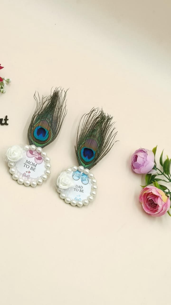 Baby shower brooch for mom and dad worn during baby shower celebration