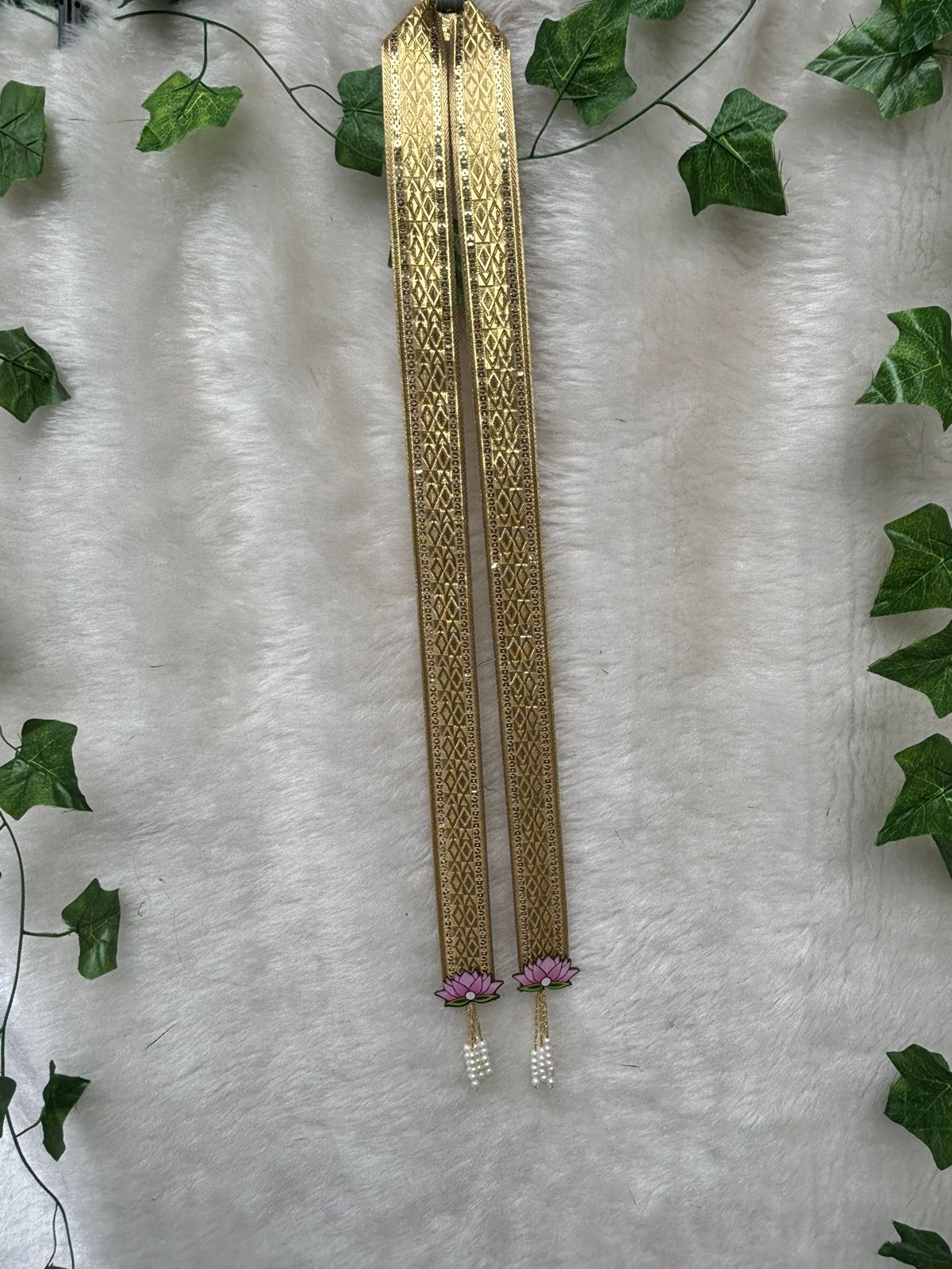 Groom wearing golden swagat phatka in Indian wedding