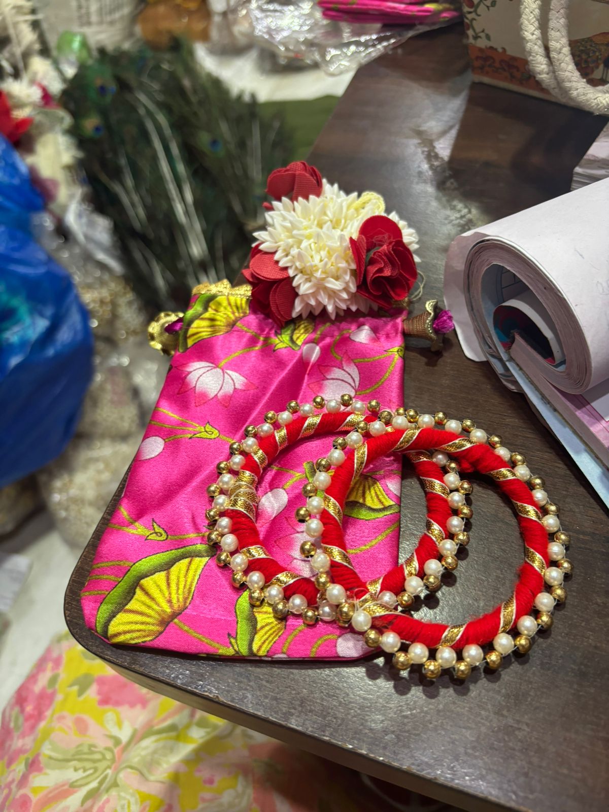 Wedding return gift hamper with mini pouch bangles and scented gajra for haldi and mehendi function