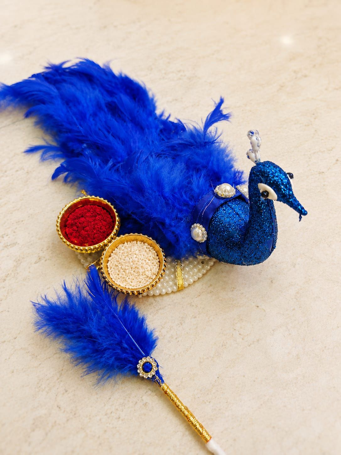 Traditional Blue Peacock Design Roli Chawal Set placed for puja and festive gifting