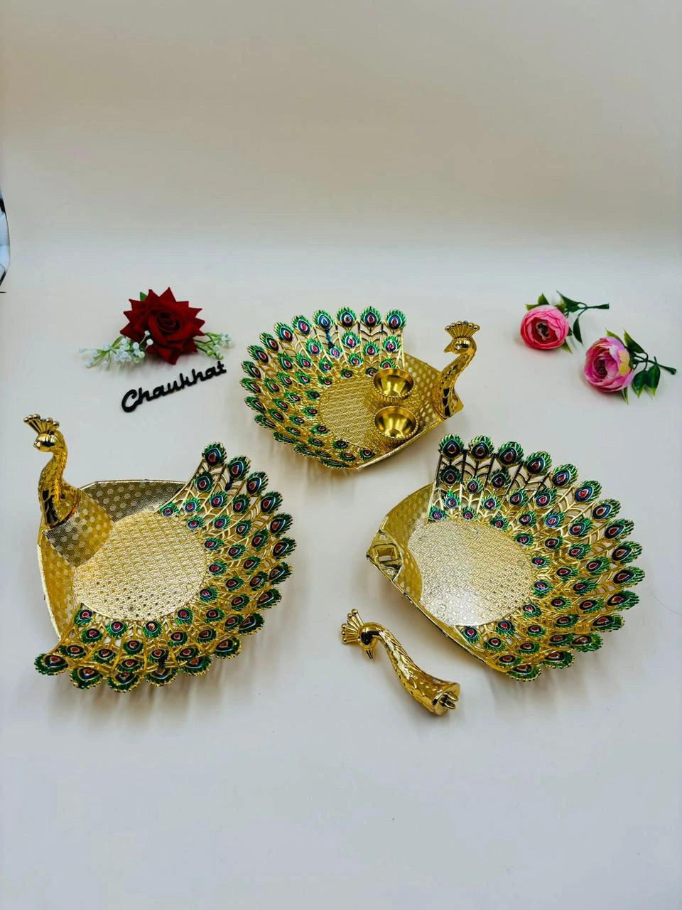 Decorative peacock roli chawal thali for Raksha Bandhan, puja, and traditional rituals
