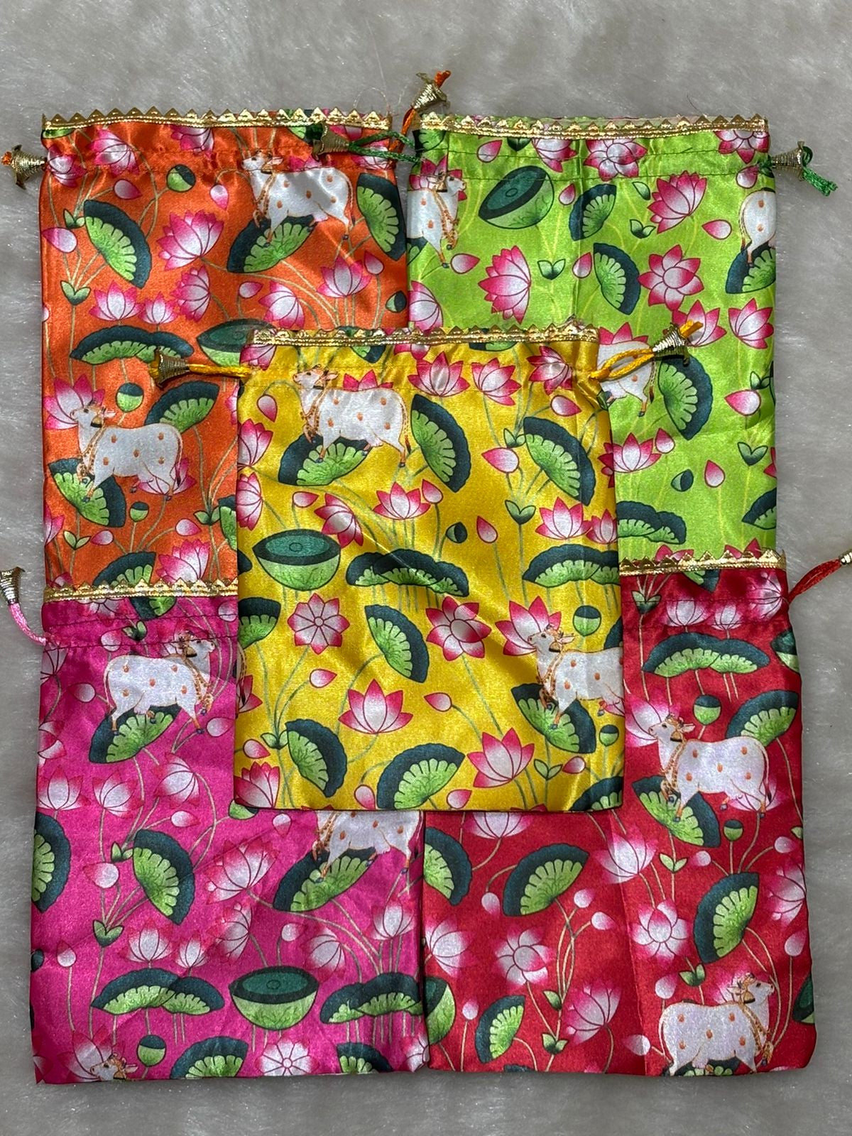 Elegant Pichwai print potli bag for women, perfect for bridal functions, festivals, and ethnic outfits