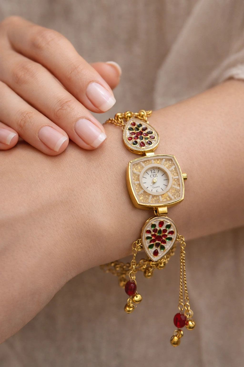 Kashmiri design gold bracelet watch with meenakari stones and tassel for women