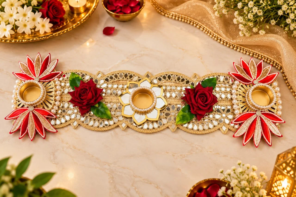 Designer floral table runner with red roses and tealight holders for Diwali home decoration