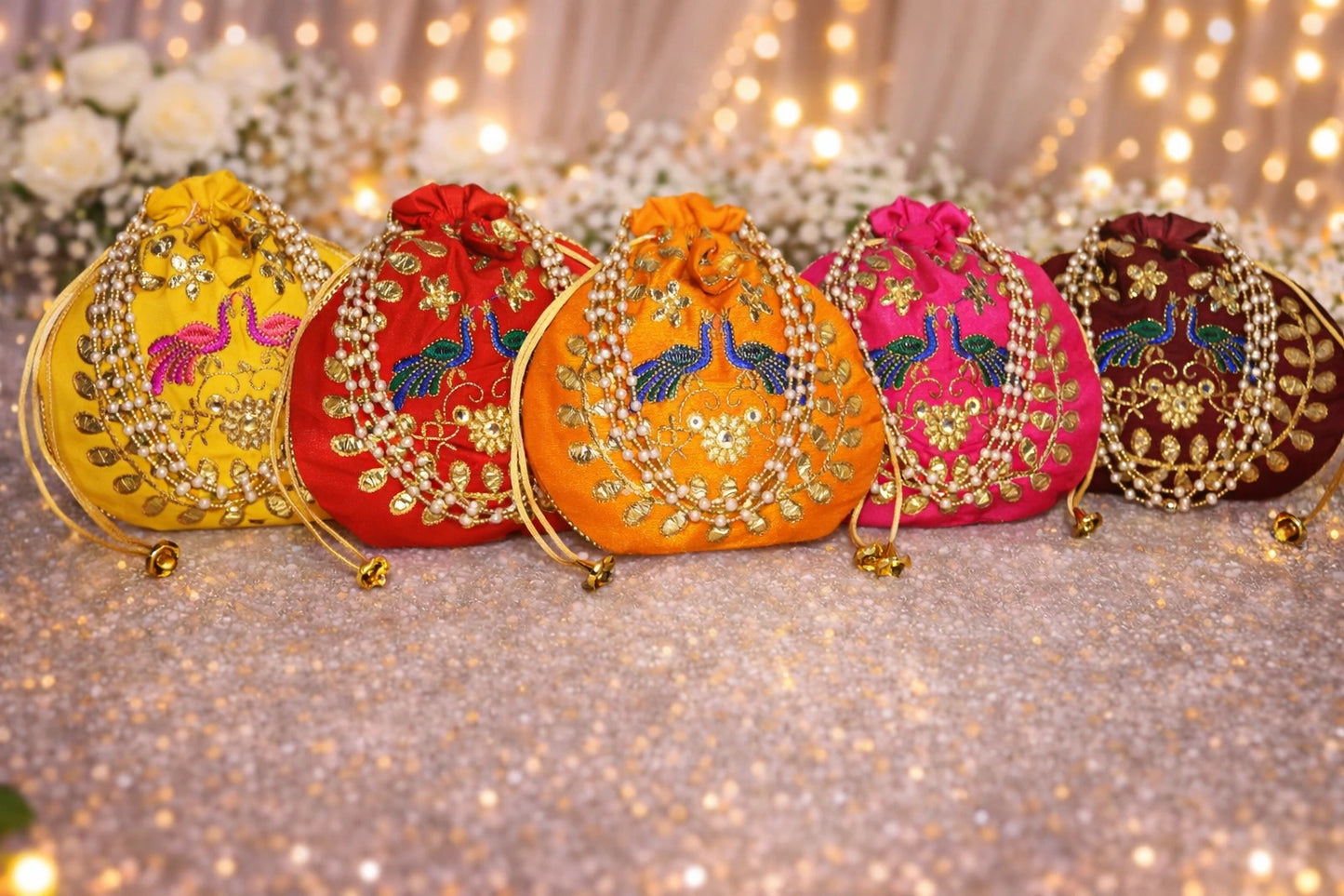 Handmade peacock embroidery potli bag with traditional gota patti work, perfect for wedding return gifts and festive gifting.