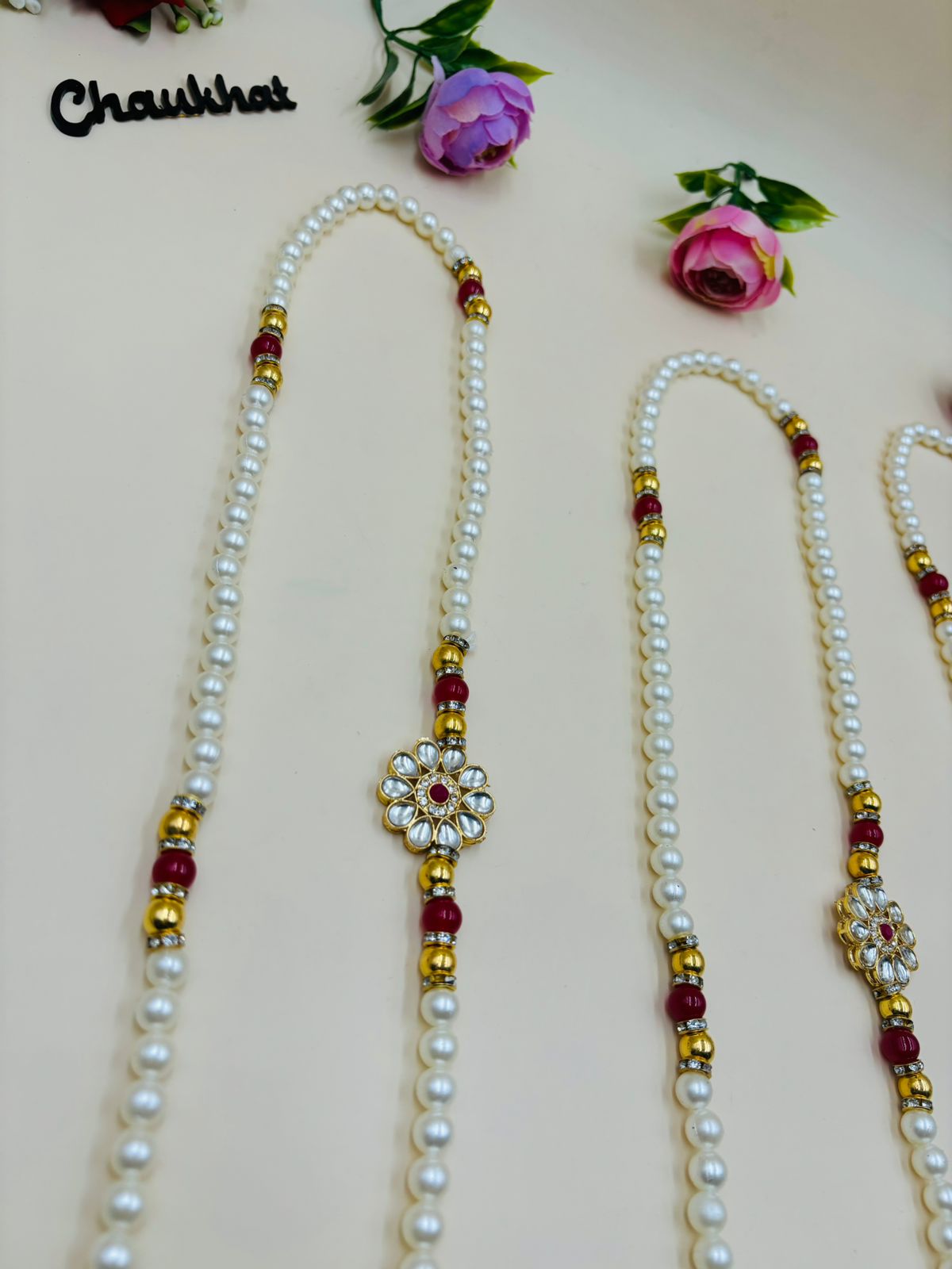 Pearl mala necklace with kundan flower centerpiece for wedding and festive wear