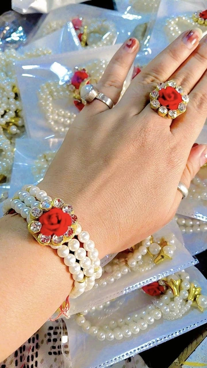 Pearl and flower design bracelet and ring combo set for bridal and festive wear
