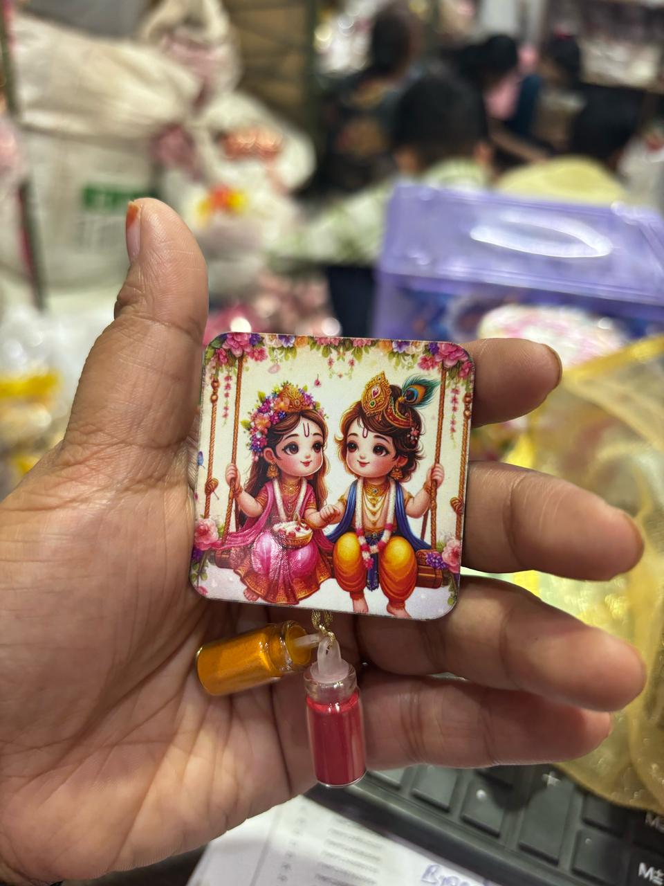 Radha Krishna design haldi kumkum set used for puja and religious rituals