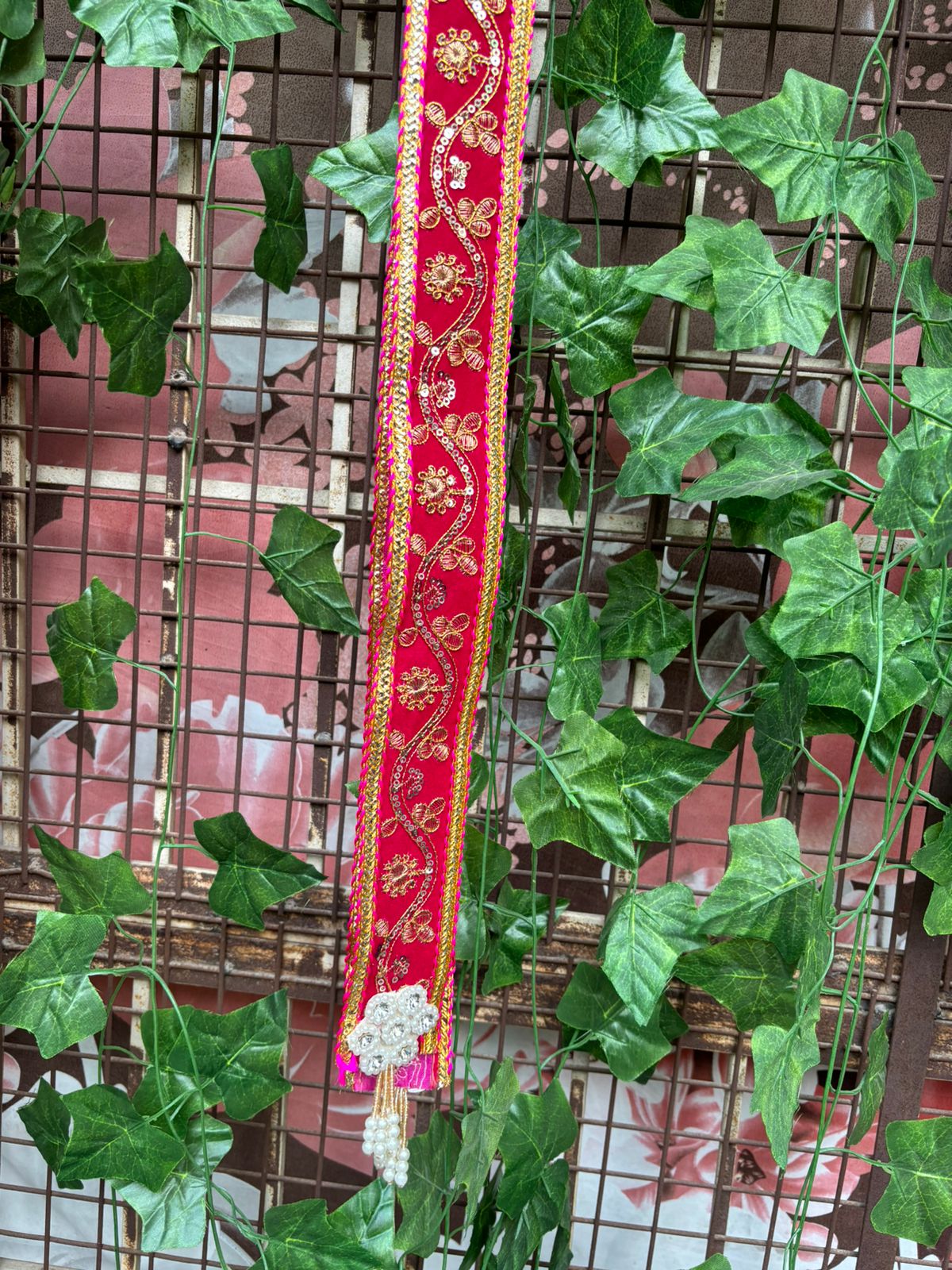 Red embroidered wedding swagat phatka with pearl latkan used for barat welcome ceremony