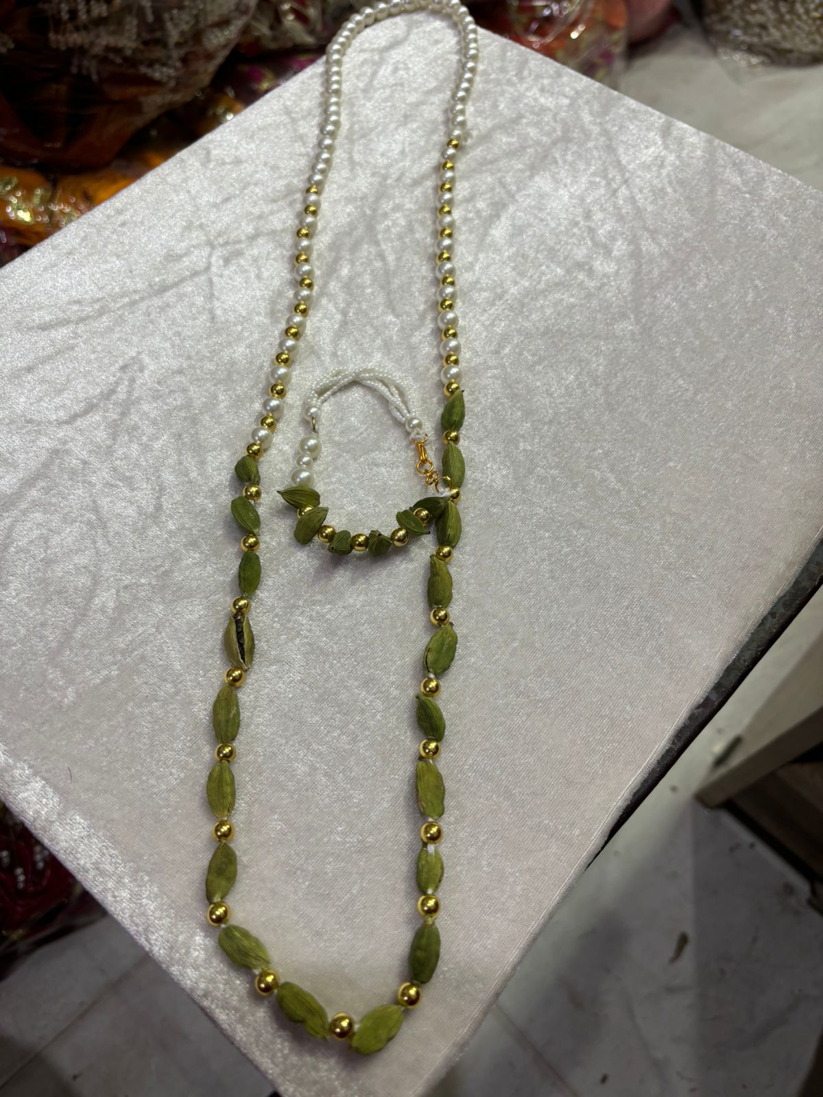 Traditional elaichi beads mala and bracelet set used for Indian wedding welcome ceremony