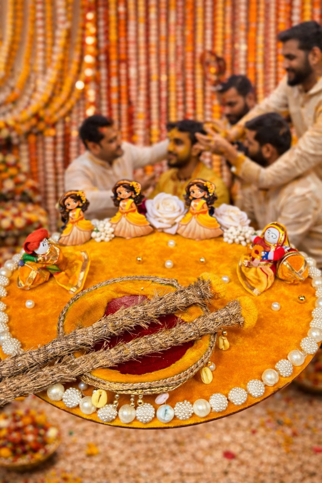 Traditional haldi ceremony platter with dolls and floral decoration