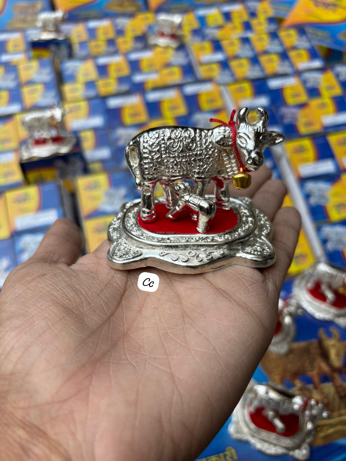 Traditional Kamdhenu cow and calf idol placed for pooja and Diwali decoration