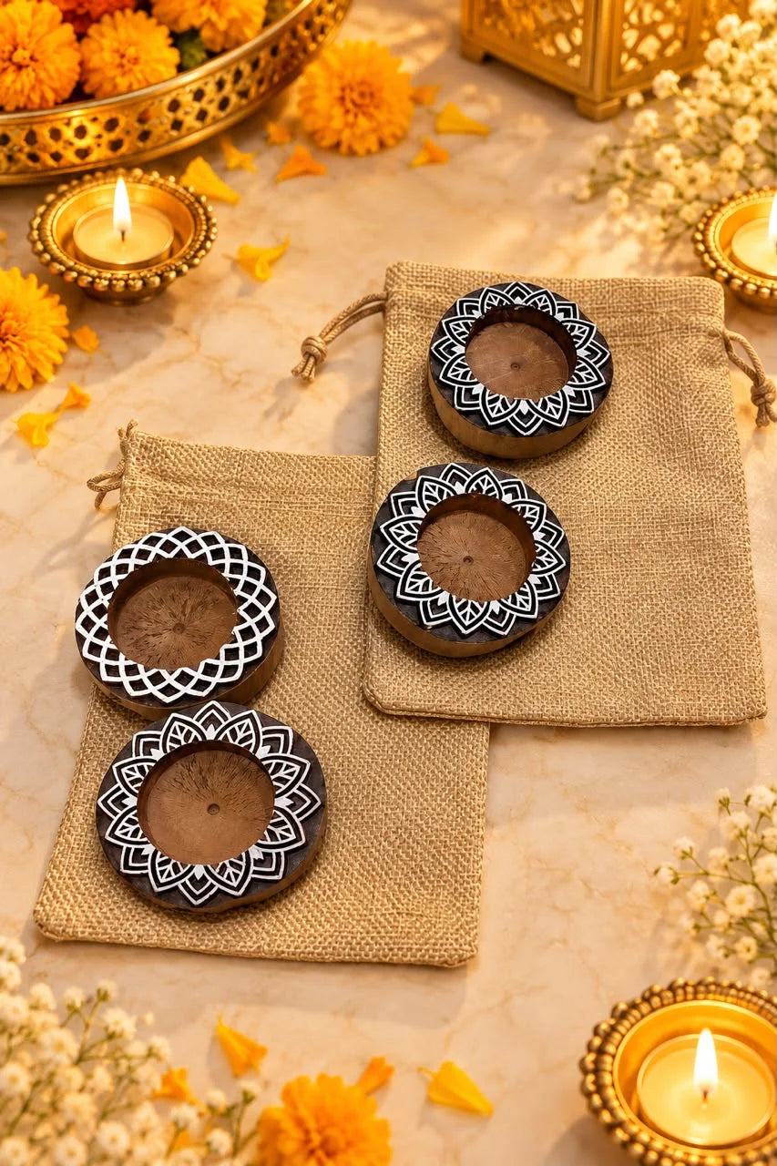 Diwali gift hamper featuring two wooden tealight holders packed in a decorative potli bag for festive gifting and return gifts.