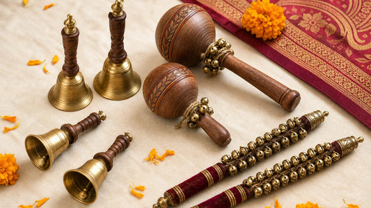 wedding phera bells arranged beside wooden rattles and ghungroo sticks for an Indian ceremony