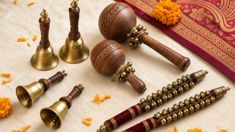 wedding phera bells arranged beside wooden rattles and ghungroo sticks for an Indian ceremony
