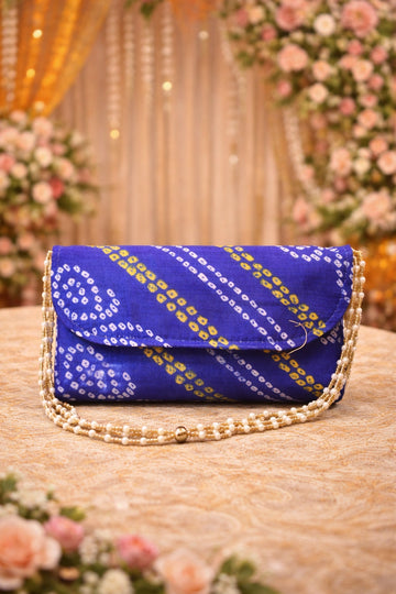 Red and yellow Bandhej clutch bag with pearl sling, perfect for wedding functions and festive occasions