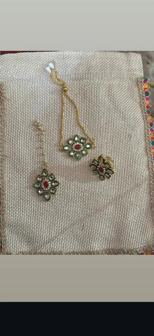 Traditional bracelet ring and mangtika jewellery set packed in decorative potli bag for wedding and festive gifting