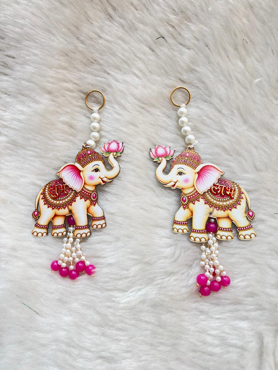Designer elephant Shubh Labh hanging pair with pearl bead detailing and pink tassels for Diwali main door decoration.