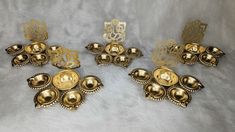 Designer golden urli diya set with Ganesh cutout for Diwali pooja and home decoration