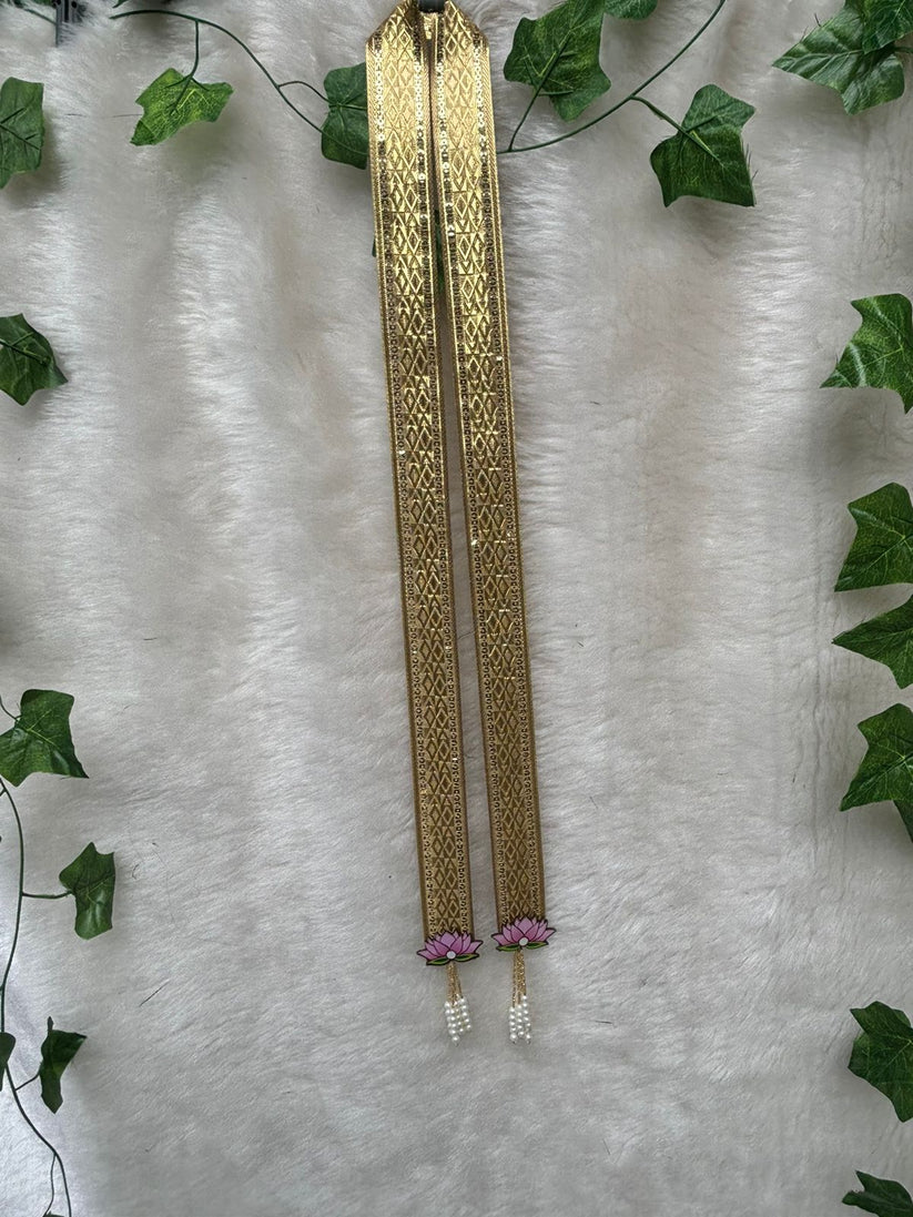 Groom wearing golden swagat phatka in Indian wedding