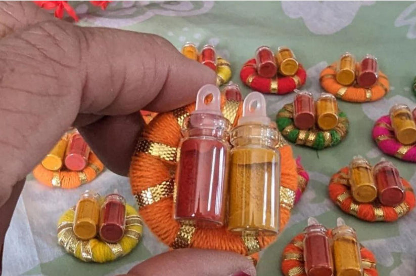 Designer haldi kumkum bottles with decorative ring for wedding and pooja return gifts