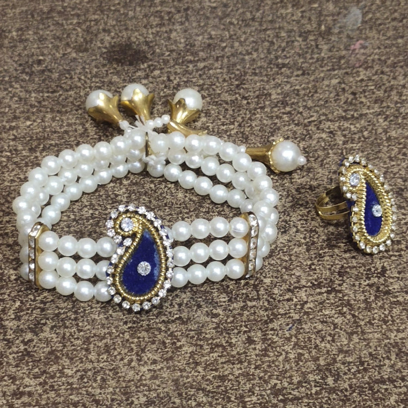 Elegant kundan bracelet with pearls and matching ring for festive and wedding wear
