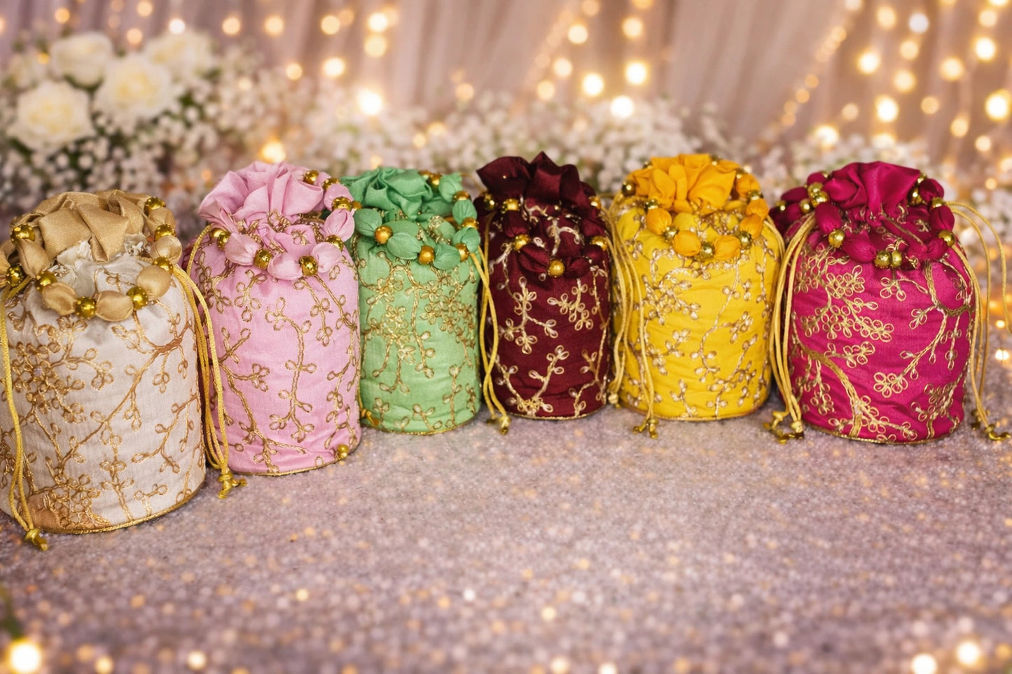 Handmade embroidered potli bag with sturdy base ideal for wedding return gifts and festive gifting