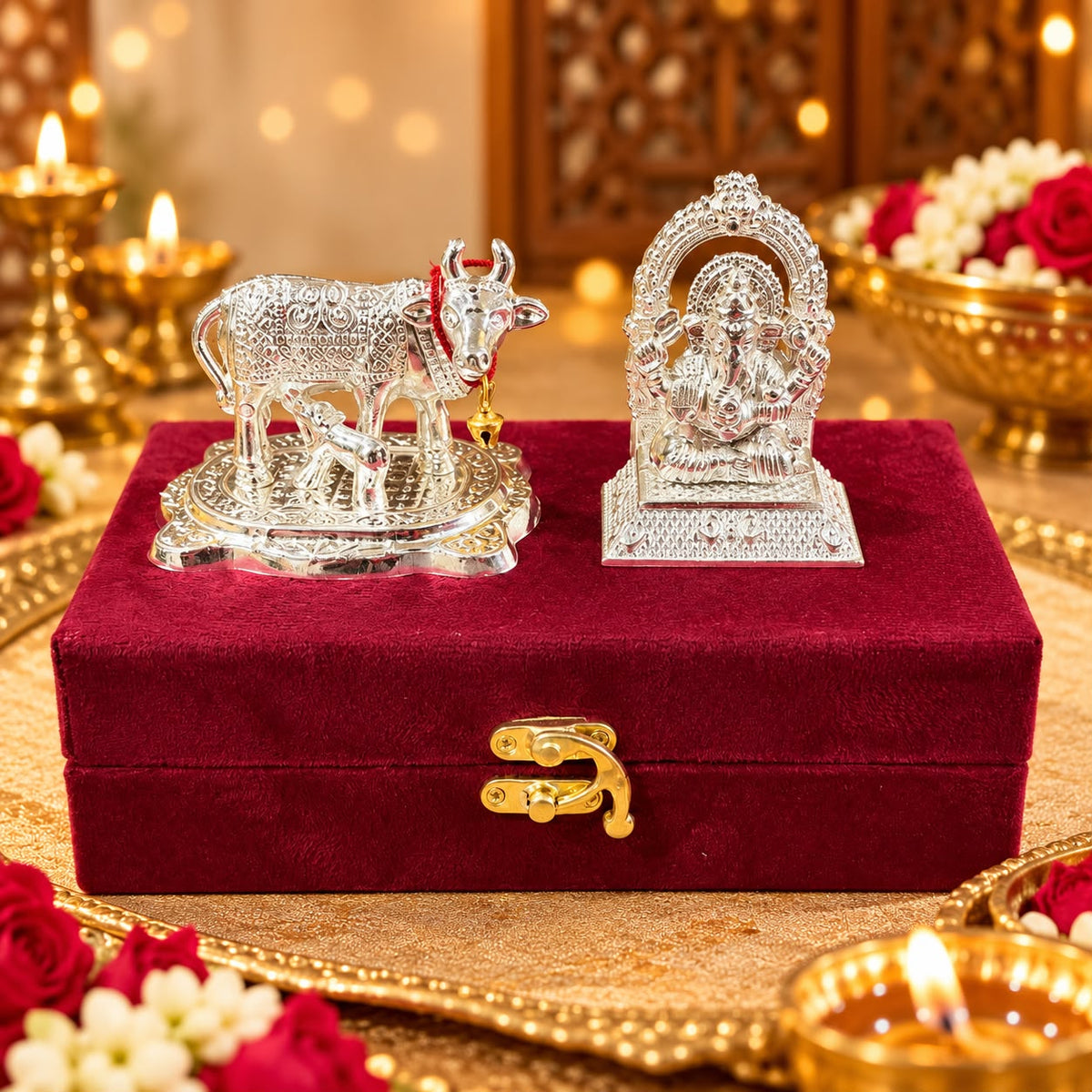 German silver cow and Ganesh Ji idol set displayed in a premium velvet gift box for Diwali gifting and home temple decoration.