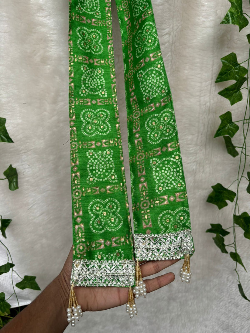 Traditional green bandhani phatka for groom welcome