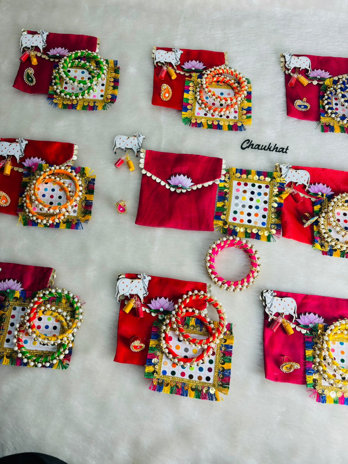 Lotus themed haldi kumkum hamper pouch with bindi sheet bangles and ring for wedding return gift