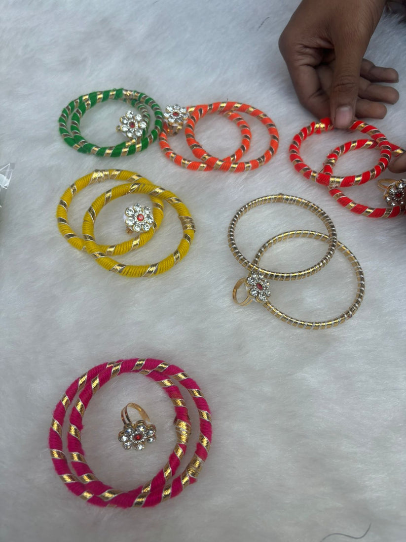 Handcrafted silk thread bangles paired with a stylish finger ring set, ideal for ethnic fashion, festivals, and bridal accessories.