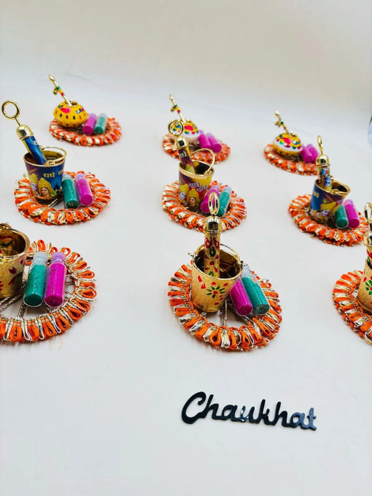 Holi gulal gift hamper with colorful balti and pichkari for festive celebration