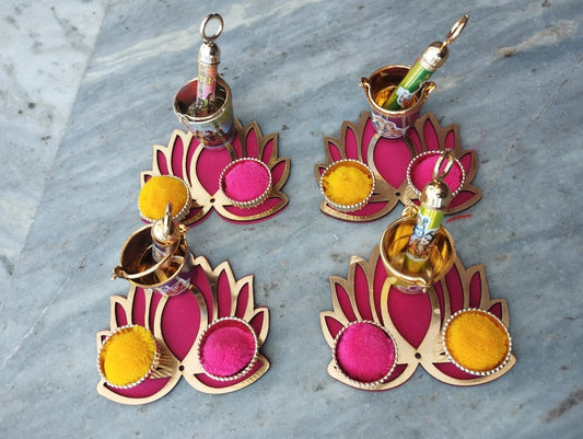 Lotus design platter holding Holi balti and pichkari for festive decoration and gifting