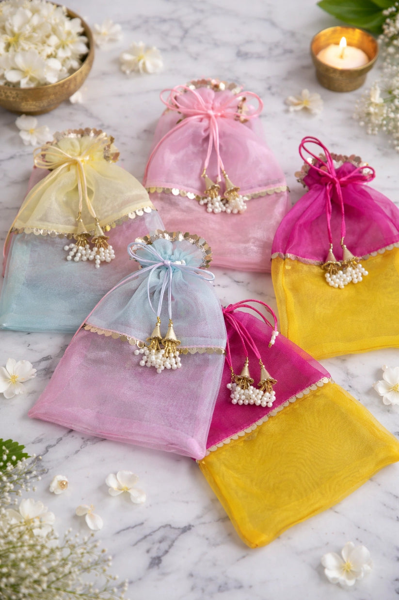 Elegant double shade designer potli bag perfect for festive gifting, wedding return gifts, and premium hamper packaging.