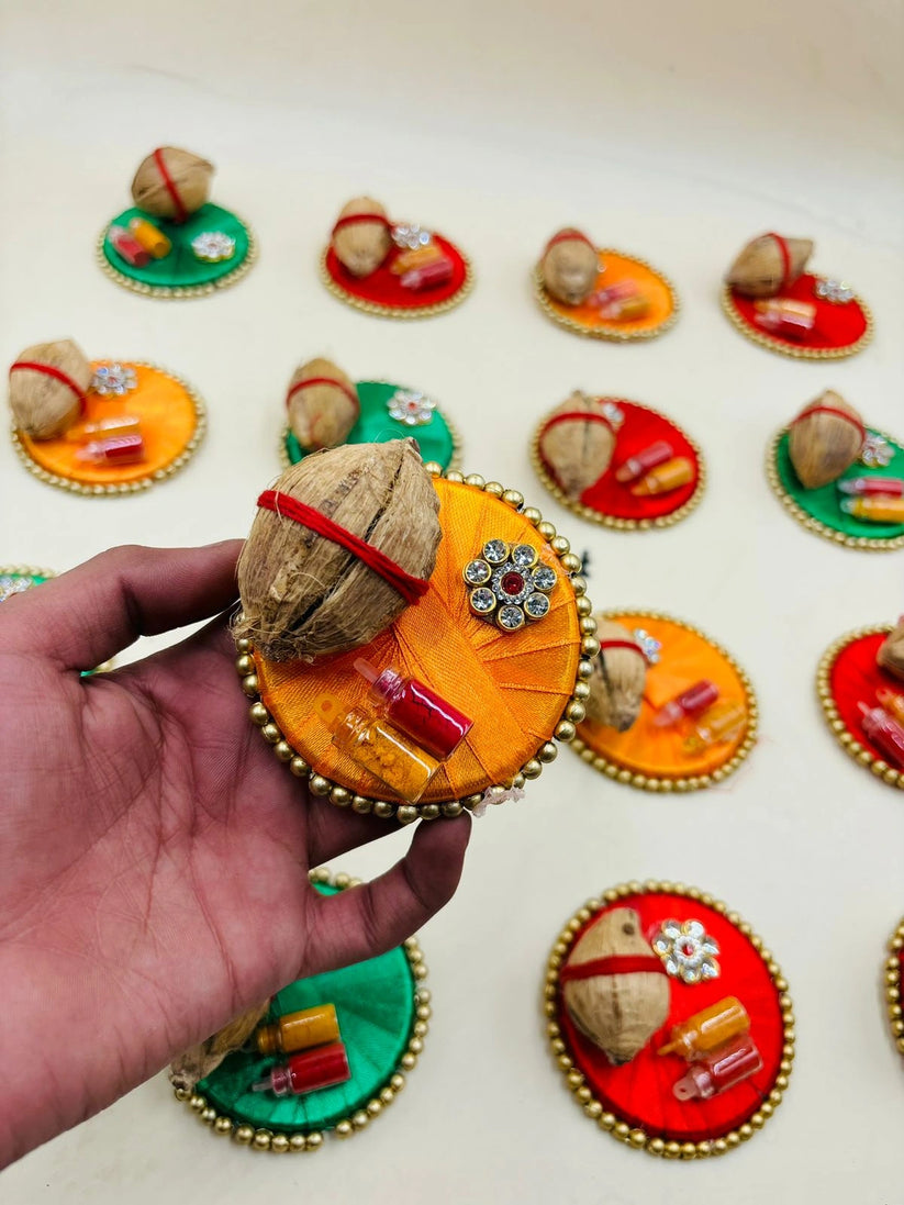 Mini haldi kumkum plate with coconut used for puja and festive rituals