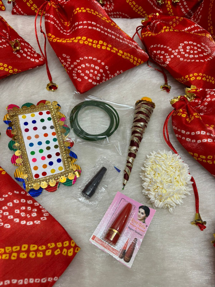 traditional mini potli with bindi kajal and gajra