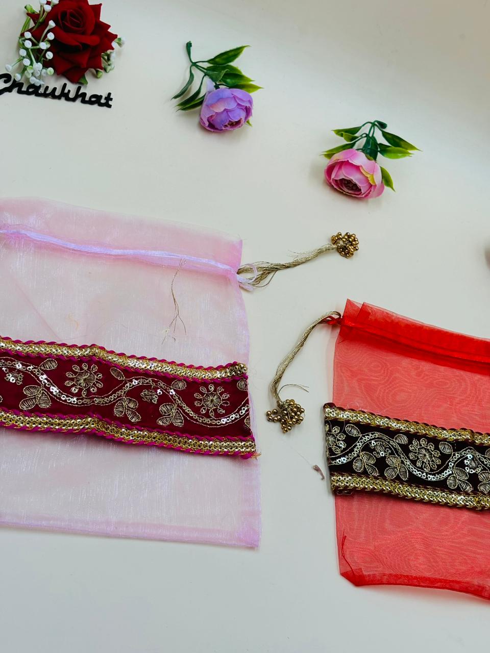 Transparent organza potli bag used for silver coin and gud shagun gift
