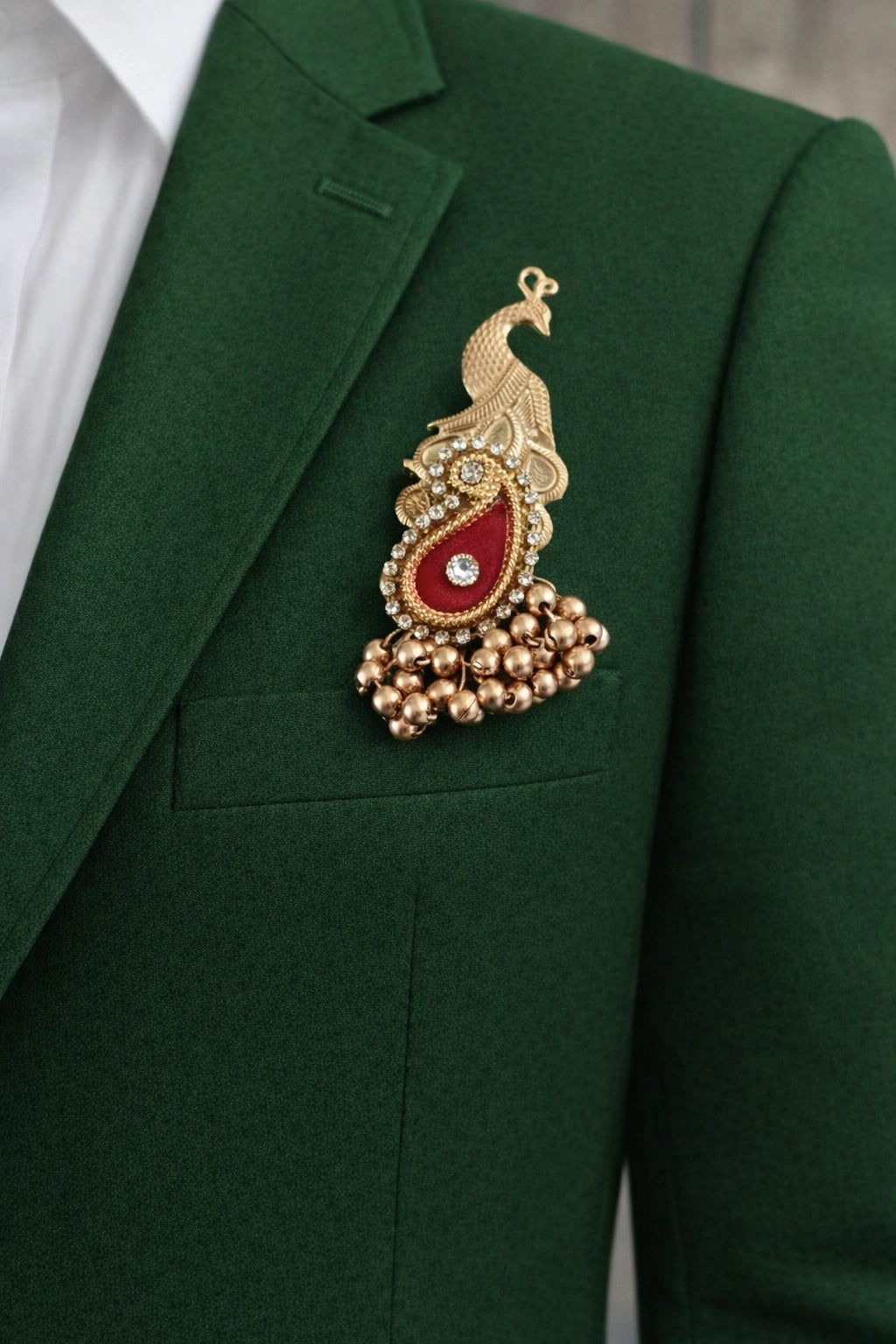 Elegant peacock brooch with kundan stones and detailed feather design