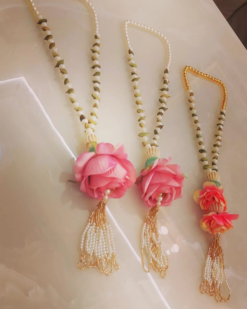 Pearl elaichi flower swagat mala used for Indian wedding welcome decoration