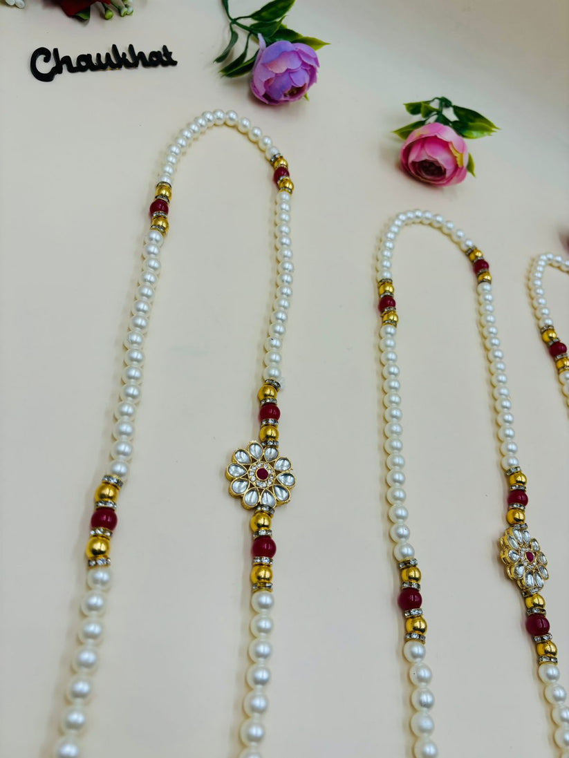 Pearl mala necklace with kundan flower centerpiece for wedding and festive wear
