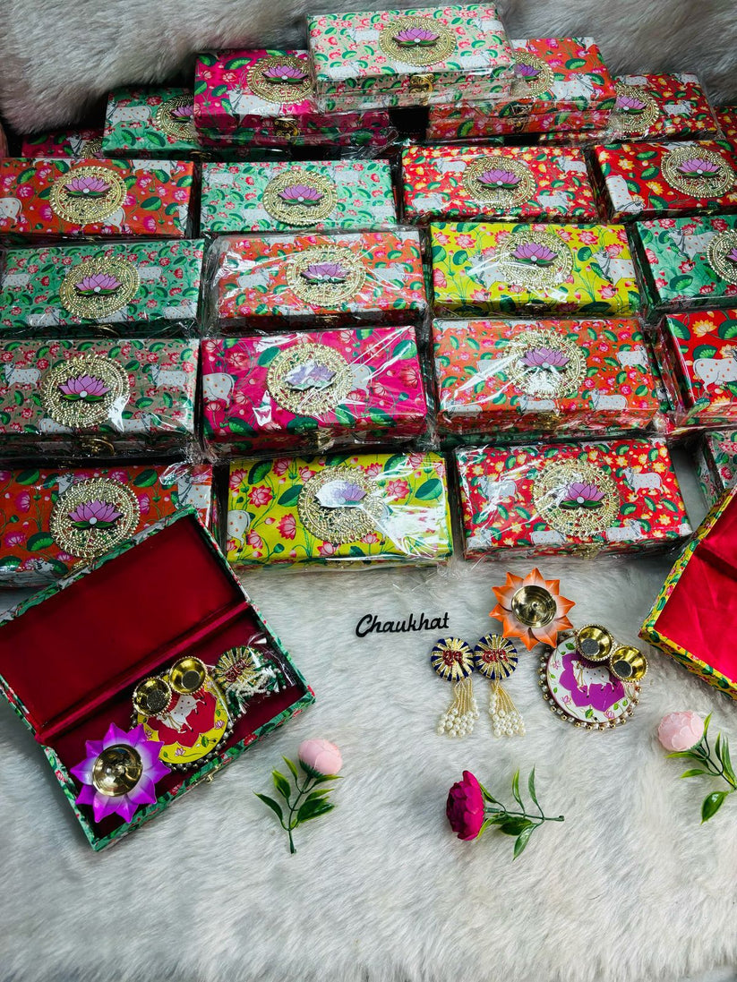 Pichwai design pooja box with Shubh Labh symbols, roli chawal plate and brass diya for festive worship