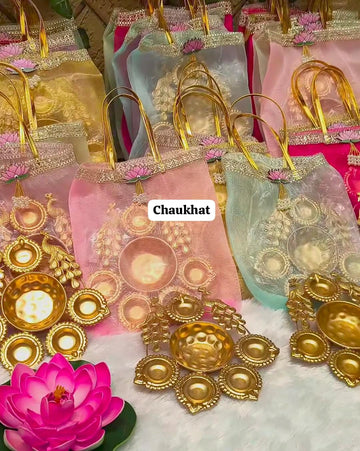 Premium decorative urli with elegant organza potli gift set for Diwali, weddings, pooja, housewarming and festive return gifting.