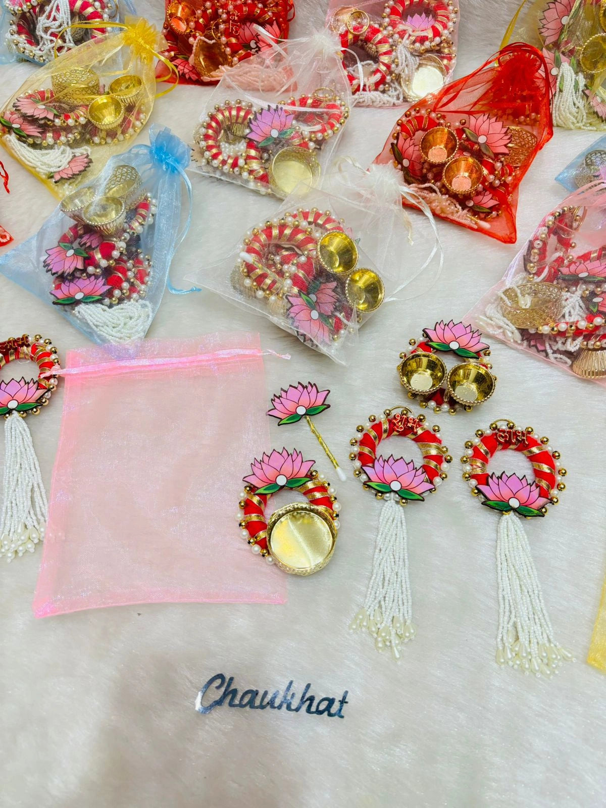 Premium festive hamper with T-Light Shubh Labh pair roli chawal platter and tilak stick packed in organza potli