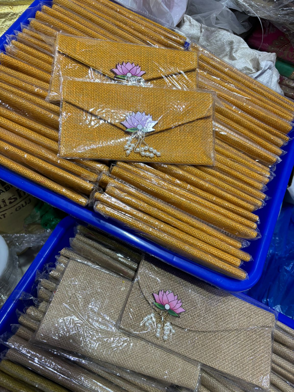 Traditional Indian wedding money envelope in velvet and jute with lotus design