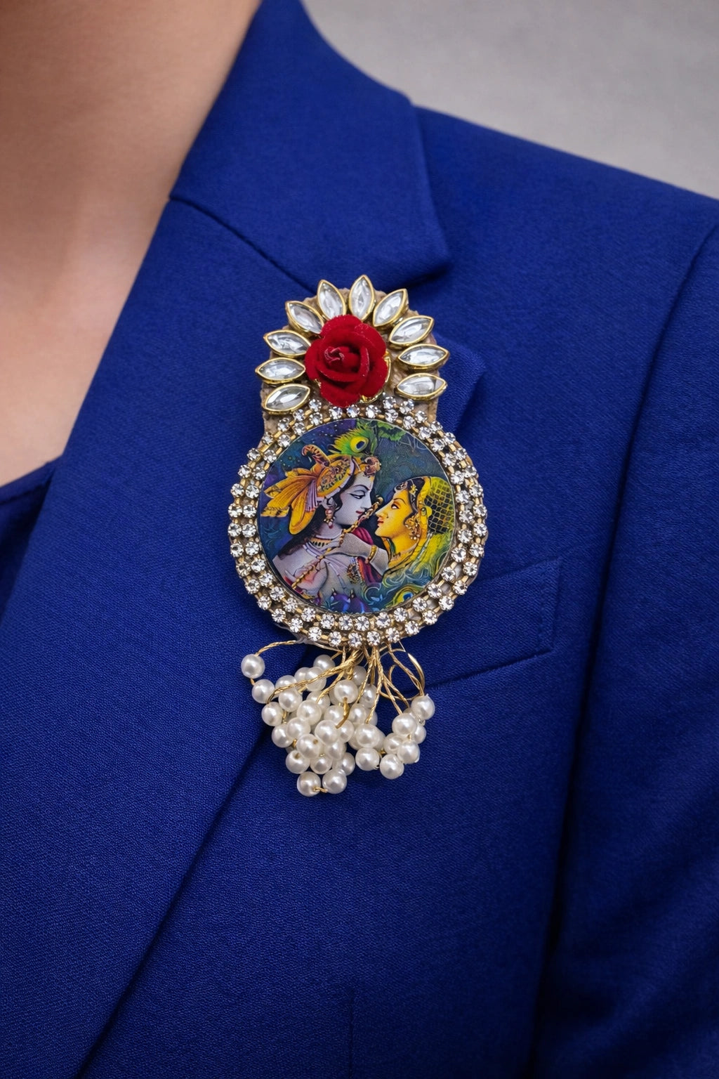 Radha Krishna brooch with kundan stones and peacock feather design