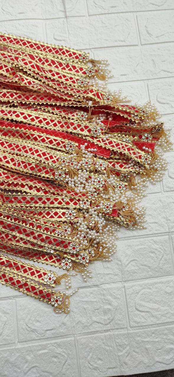 Red golden barat entry patka with pearl latkan used for traditional wedding welcome