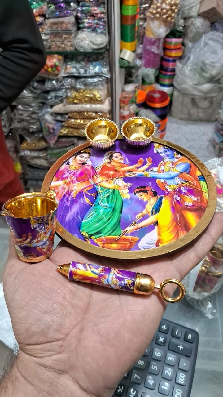 Small decorative Holi balti with pichkari and plate used for festive gifting and decoration purposes