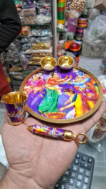 Small decorative Holi balti with pichkari and plate used for festive gifting and decoration purposes