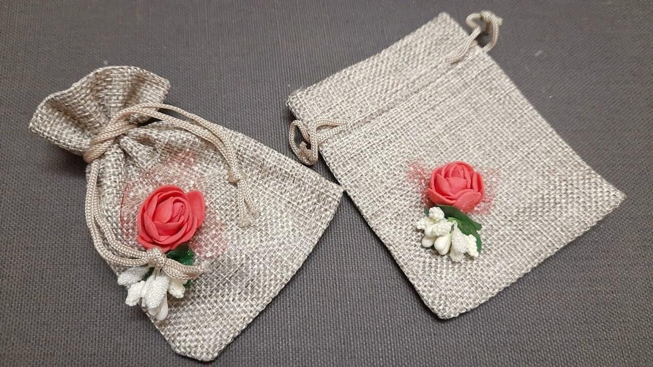 Eco-friendly small jute gifting bag with floral print, perfect for hampers, party favors, and return gifts