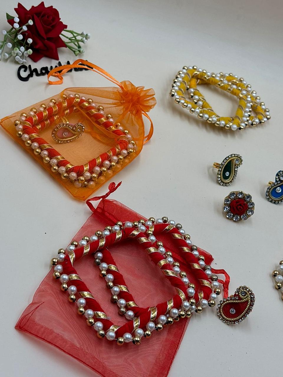 Designer square pearl bangle and ring set with matching potli bag for wedding and festive gifting